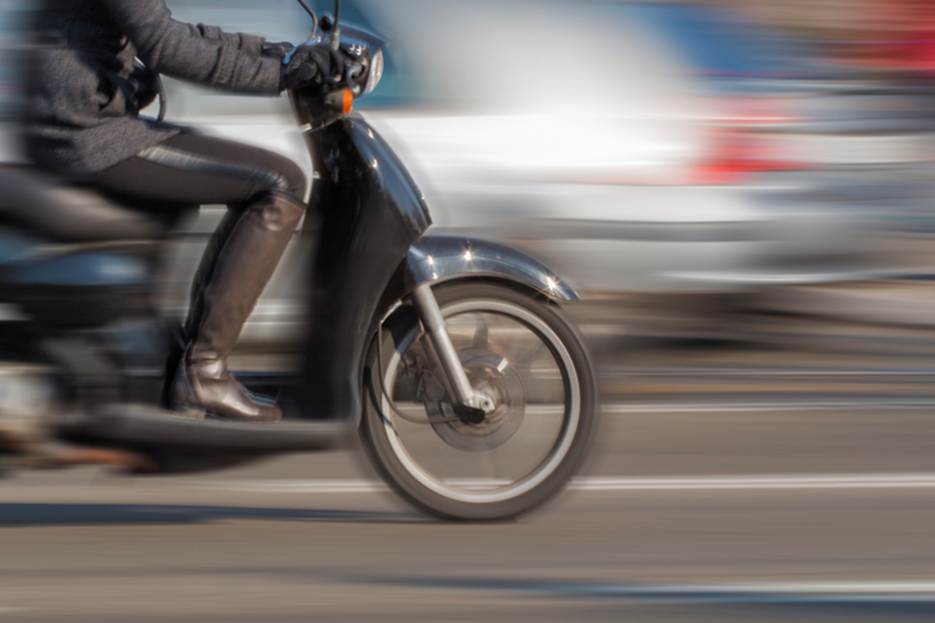 A person riding a scooter
AI-generated content may be incorrect.